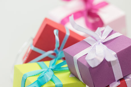 A colourful selection of boxed gifts tied with pretty ribbons