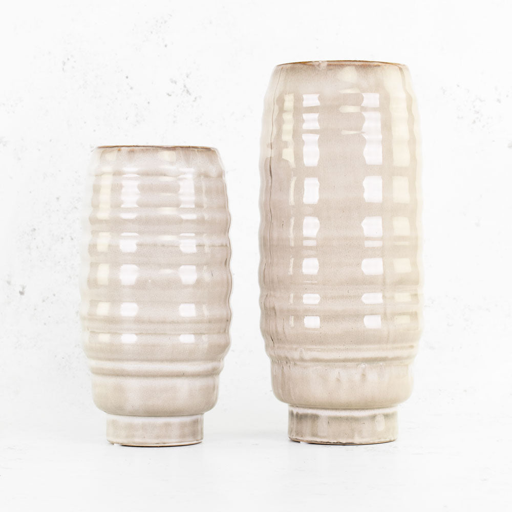 Two creamy beige vases in two different heights