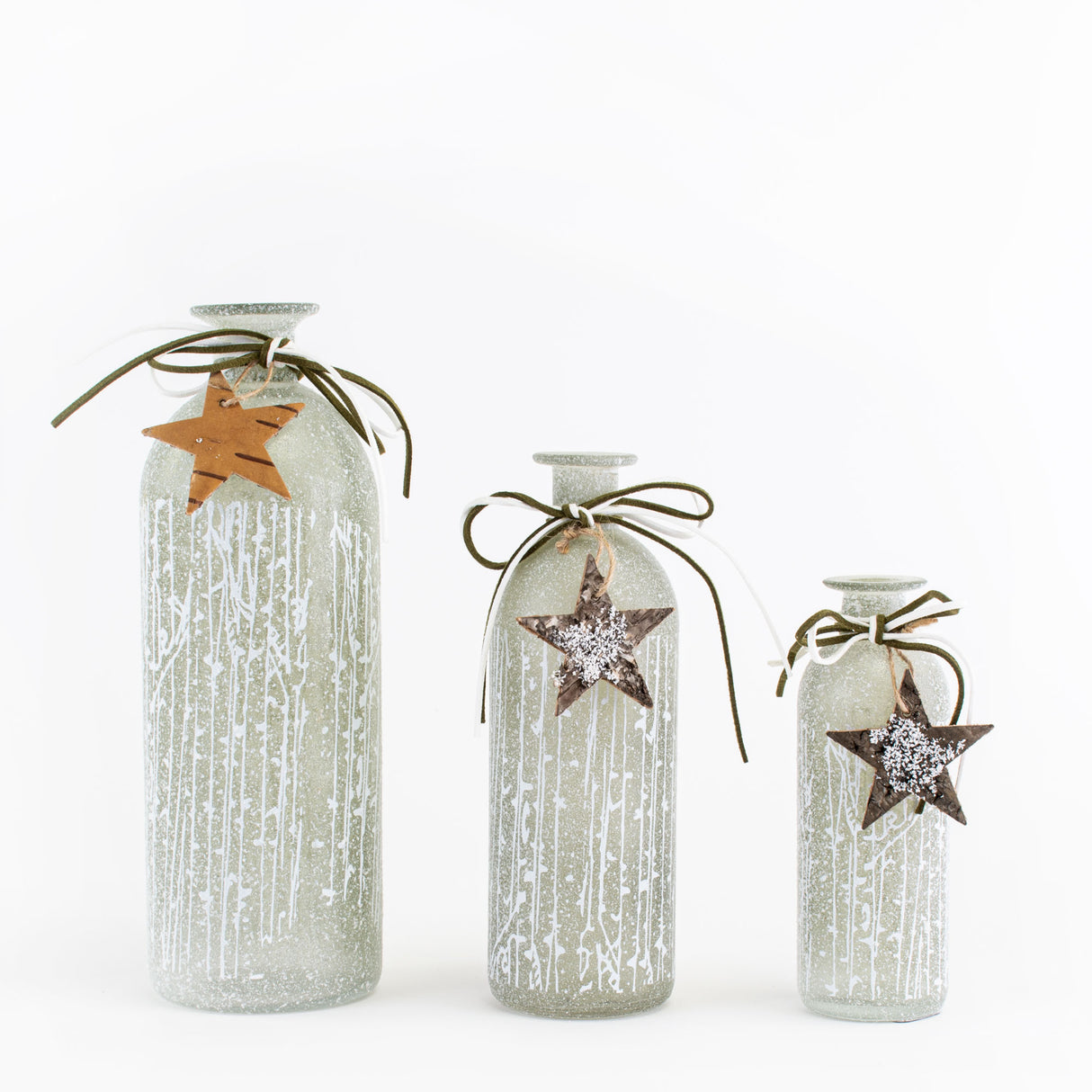 This image shows a group shot of the three pale green, frosted crystal bottle vases we sell, against a white background