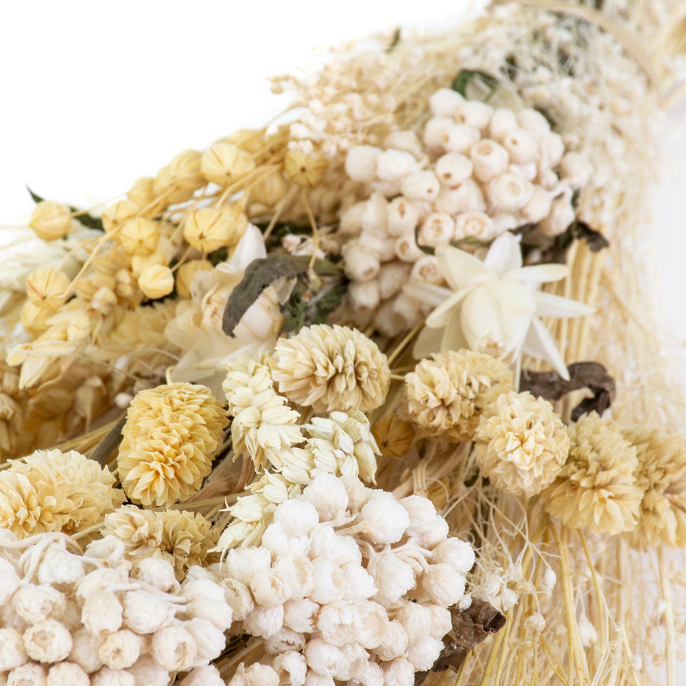 a bouquet made up with a selection of different flowers with an ecru theme