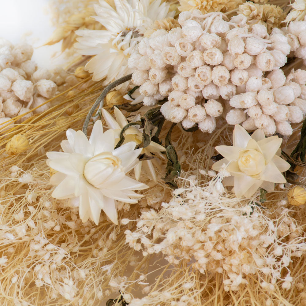 a bouquet made up with a selection of different flowers with an ecru theme