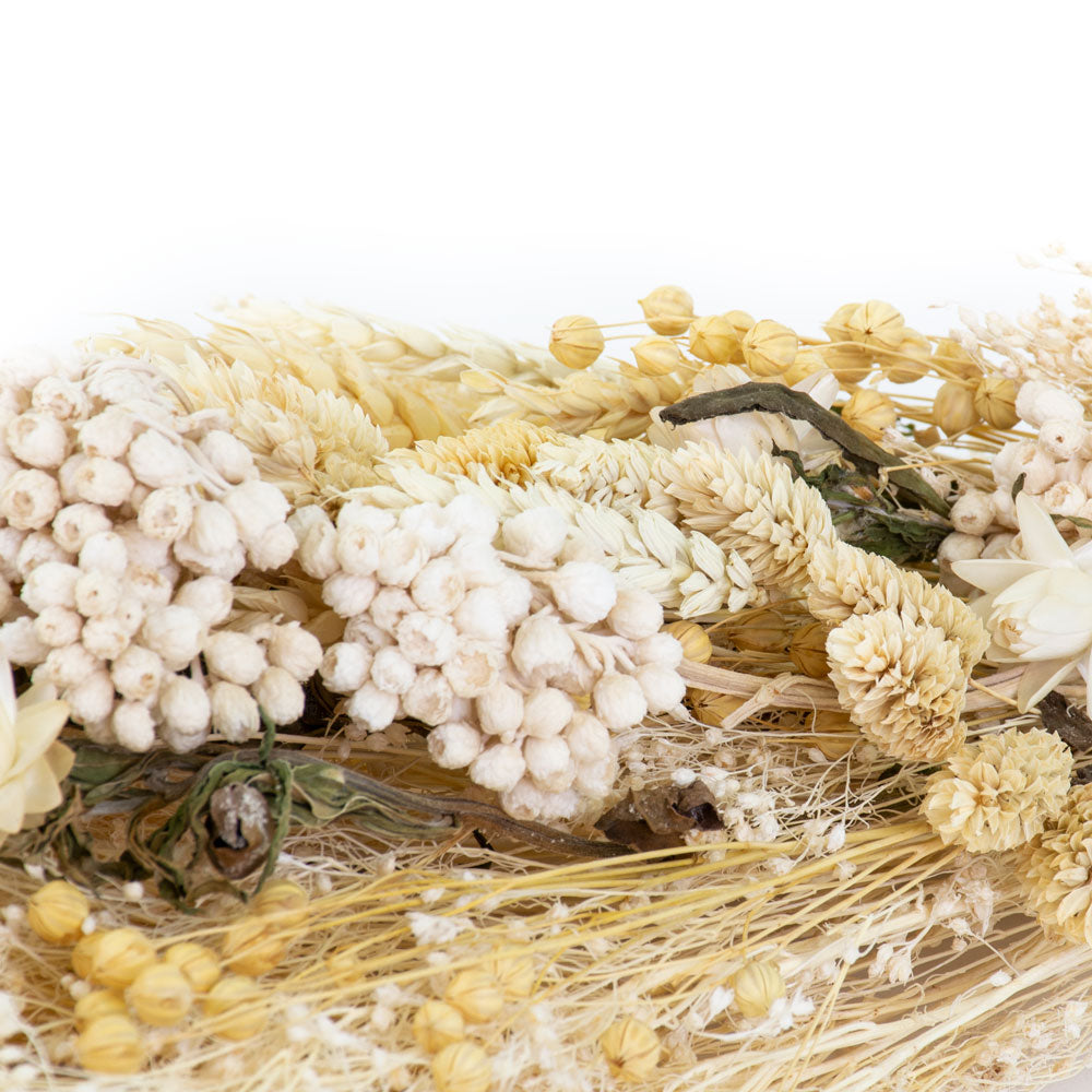 a bouquet made up with a selection of different flowers with an ecru theme