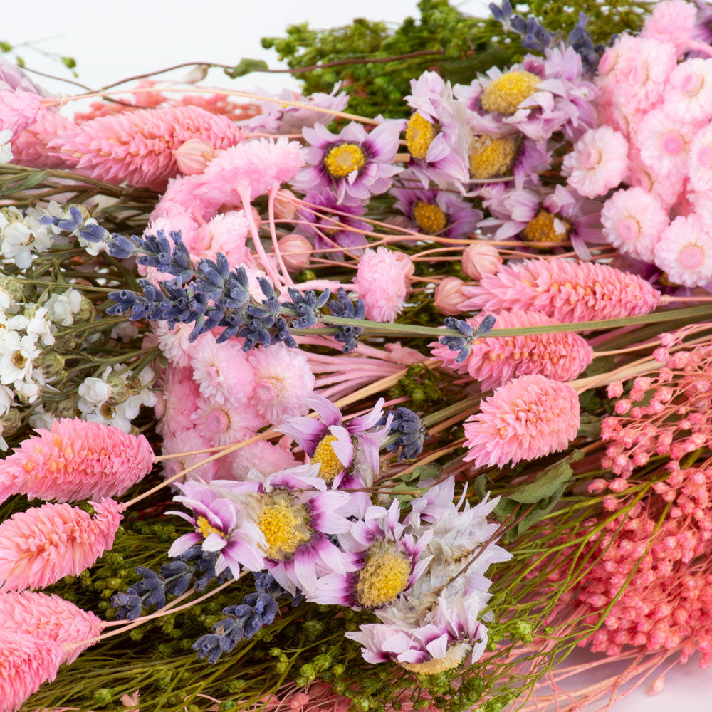 a bouquet made up with a selection of different flowers with a pink theme