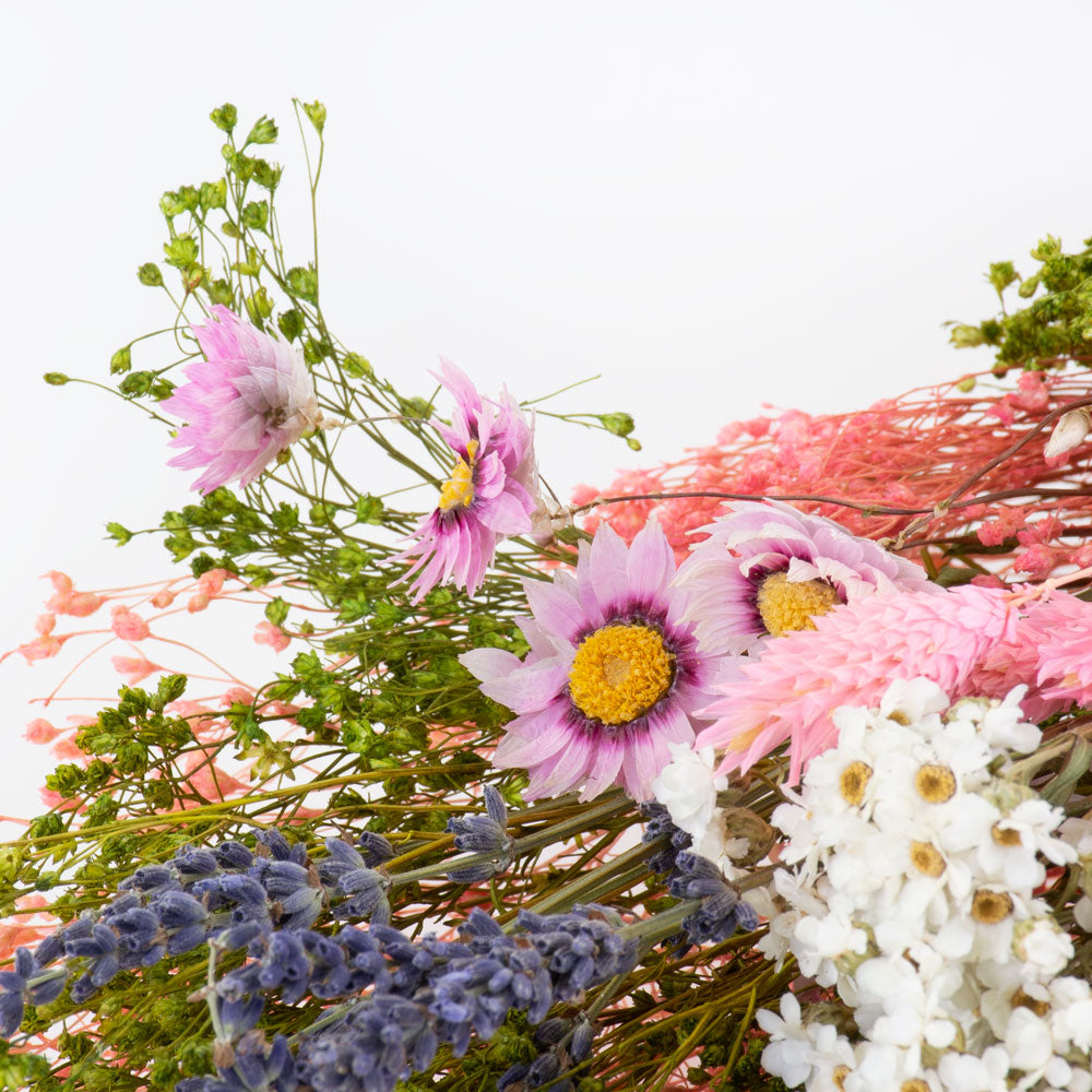 a bouquet made up with a selection of different flowers with a pink theme