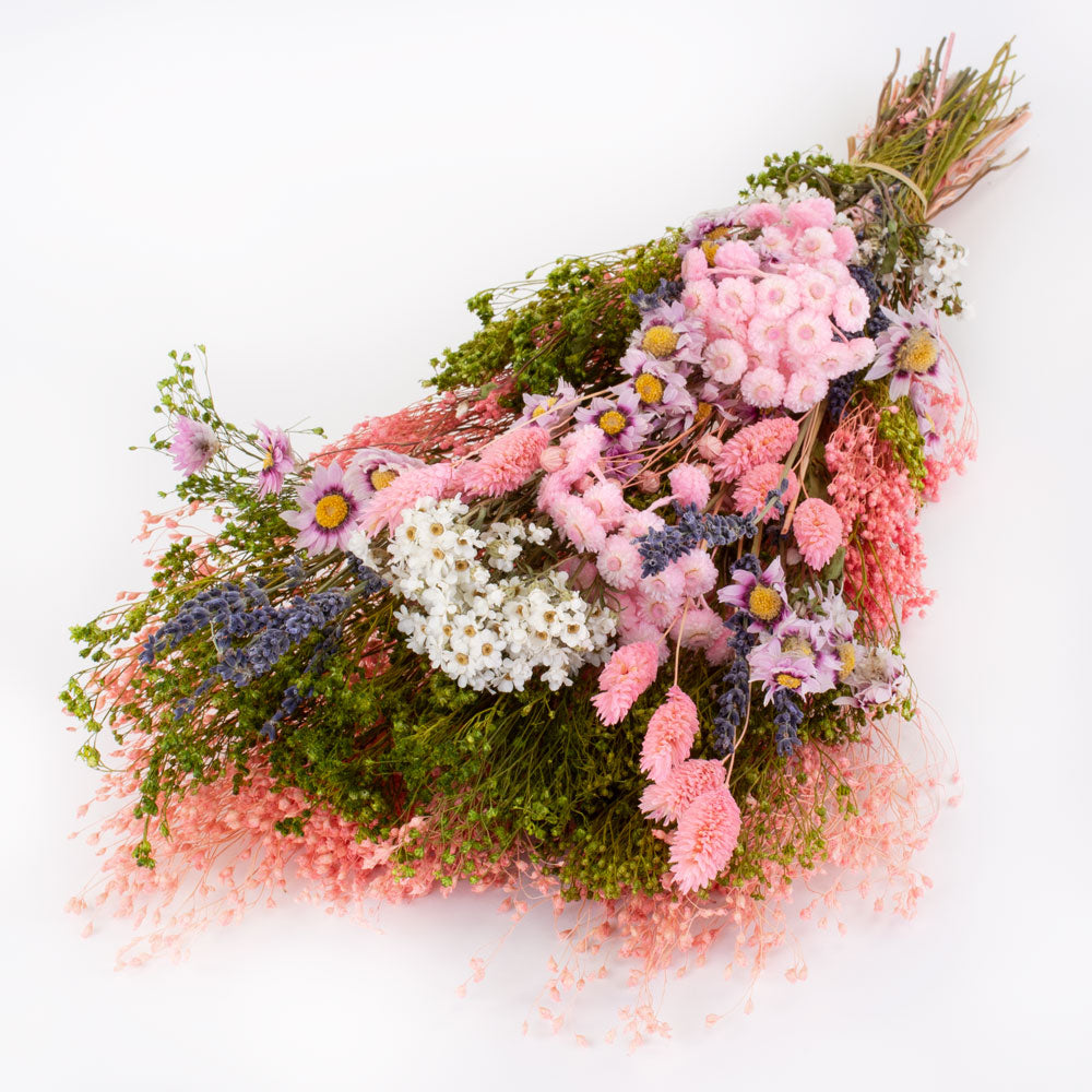 a bouquet made up with a selection of different flowers with a pink theme