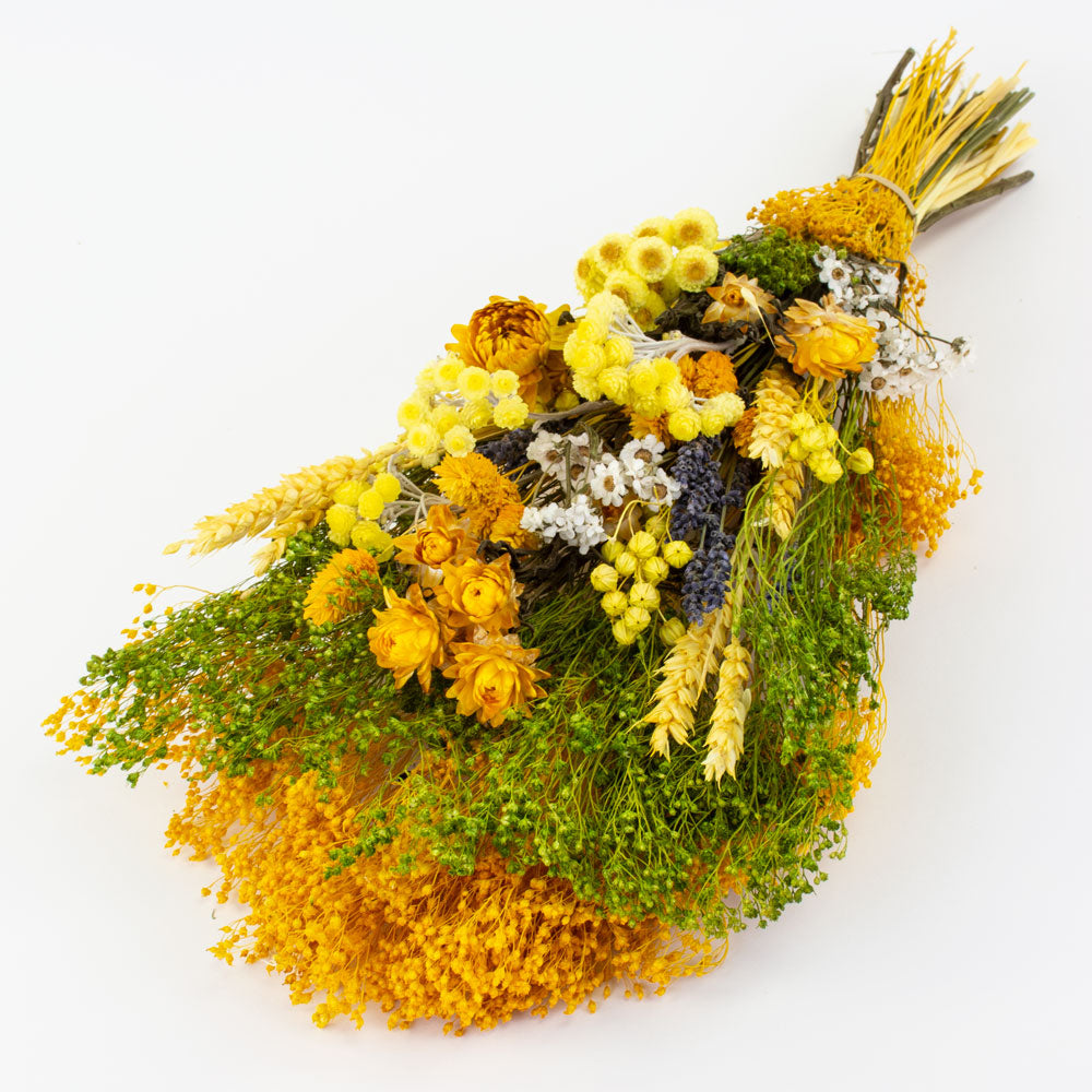 a bouquet made up with a selection of different flowers with a yellow theme