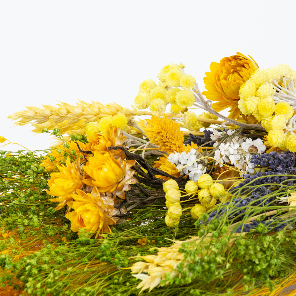 a bouquet made up with a selection of different flowers with a yellow theme