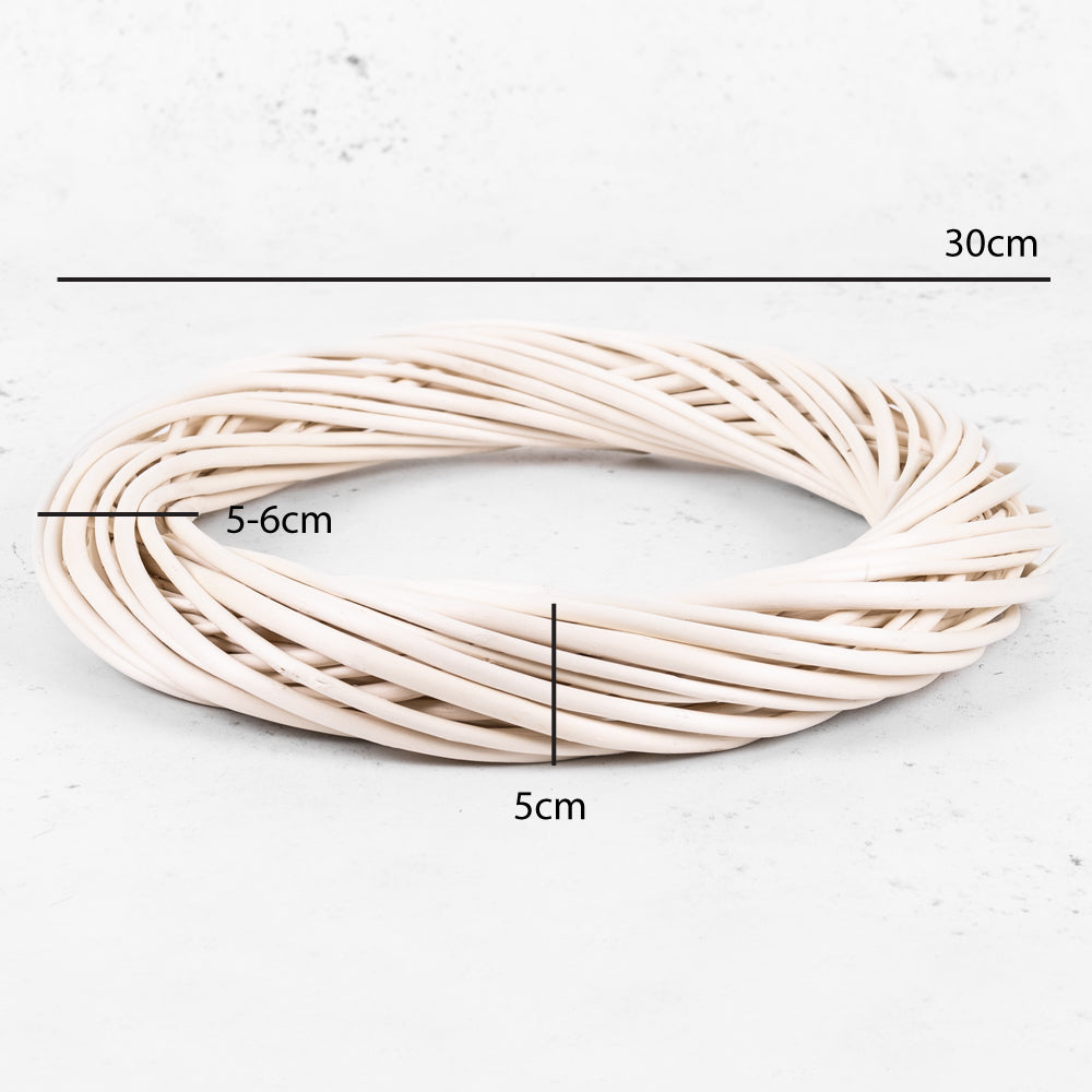 A bleached, wreath ring formed from twisted wicker stems