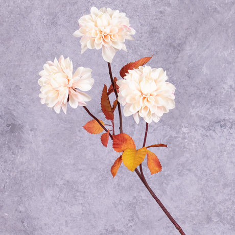 A faux dahlia spray with large, pale pink flowers and rusty orange leaves.