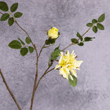 A faux yellow rose spray branch