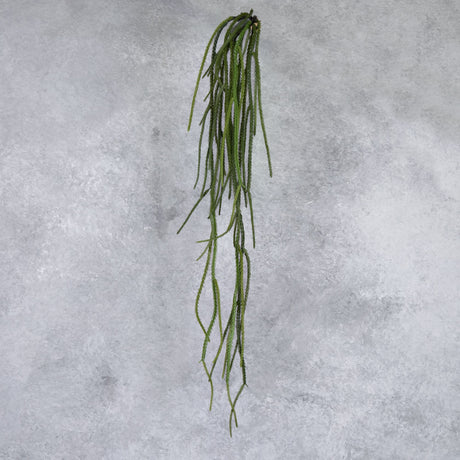 A single, faux, green, hanging grass plant.