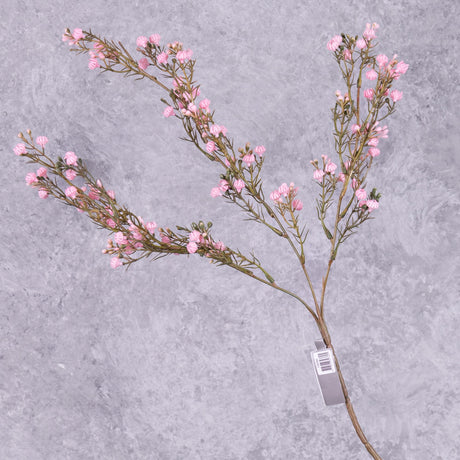 A faux gypsophila spray with light pink flowers