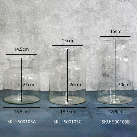 A line up of three clear glass vases of the same style but in different heights complete with their dimensions marked up.