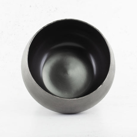 Black brushed metal pot cover interior.