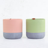 Pair of ceramic pots in two tone green and grey, and peach and grey