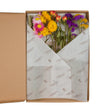 A box of Floriëtte bouquets in brown paper wrapping
