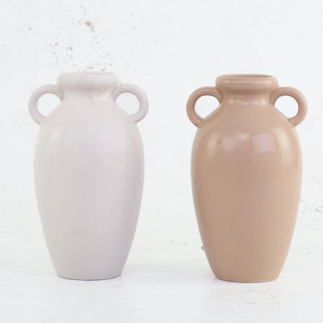 A pair of urn style vases in terracotta and white
