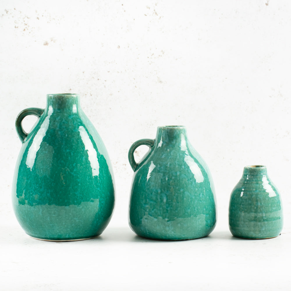 Mixed size turquoise bottle vases