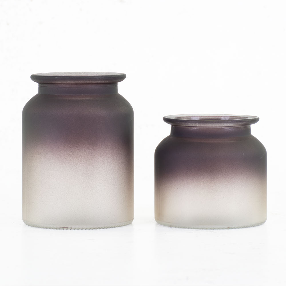 A pair of frosted glass vases in different sizes, with an ombre effect, from black to white.
