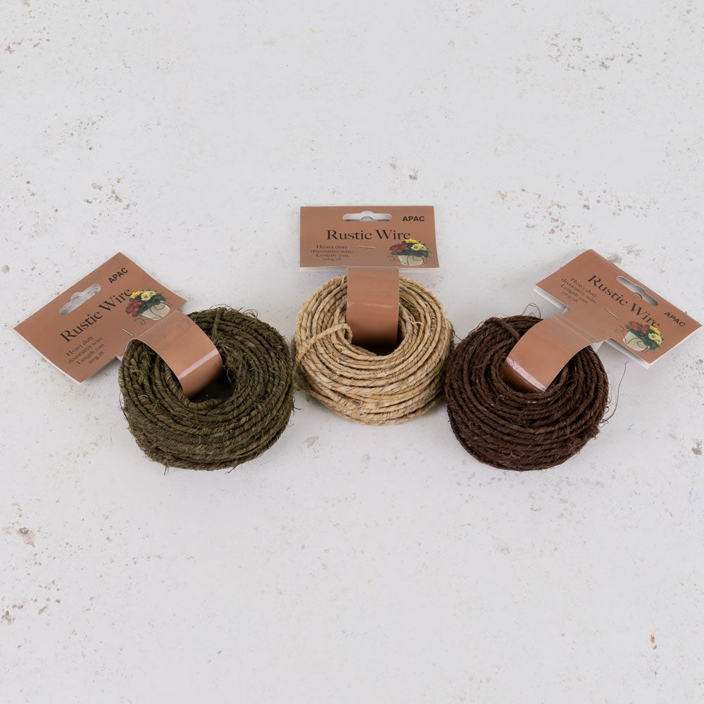 Reels of brown, green, and natural coloured rustic wire.
