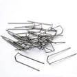 This image shows a group of mossing pins against a white background