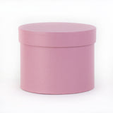 a baby pink coloured hat box