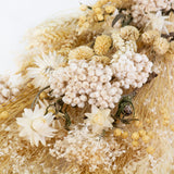 a bouquet made up with a selection of different flowers with an ecru theme