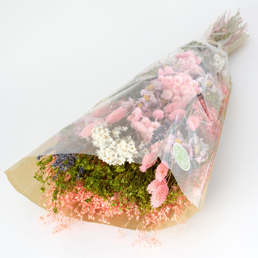 a bouquet made up with a selection of different flowers with a pink theme
