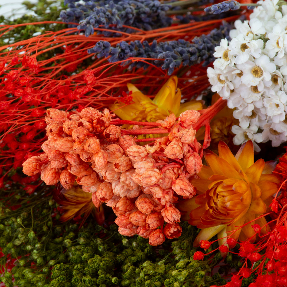 a bouquet made up with a selection of different flowers with an orange theme