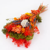 a bouquet made up with a selection of different flowers with an orange theme