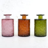 Trio of tall bud vases in mixed colours