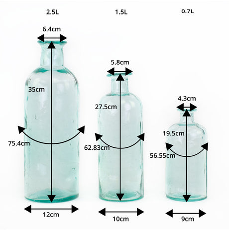 a group of three Waimaru blue/green glass bottles in different sizes