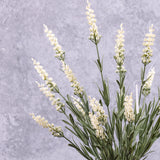 A faux lavender bush with white flowers