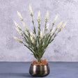 A faux lavender bush with white flowers, displayed in a black, brushed metal pot cover