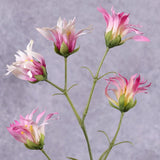 A faux pink dianthus stem with several flower heads