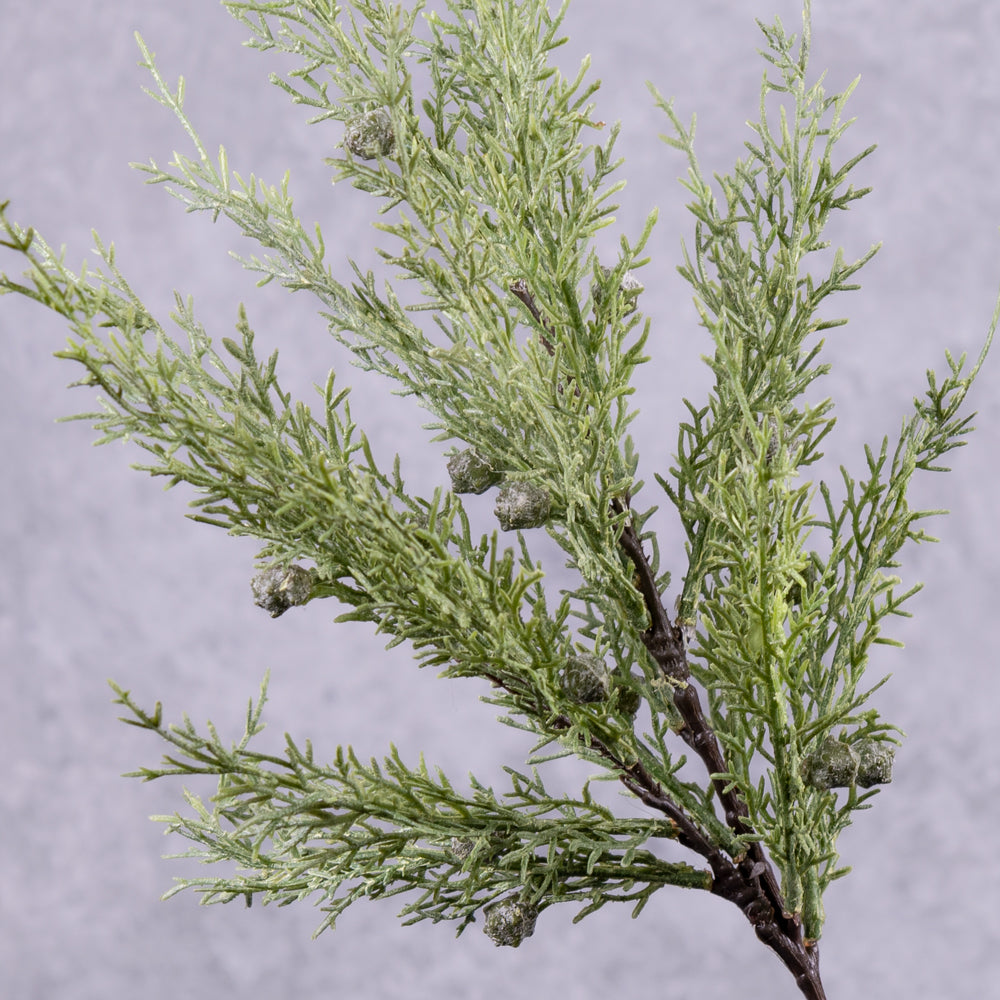 A faux juniper stem close up