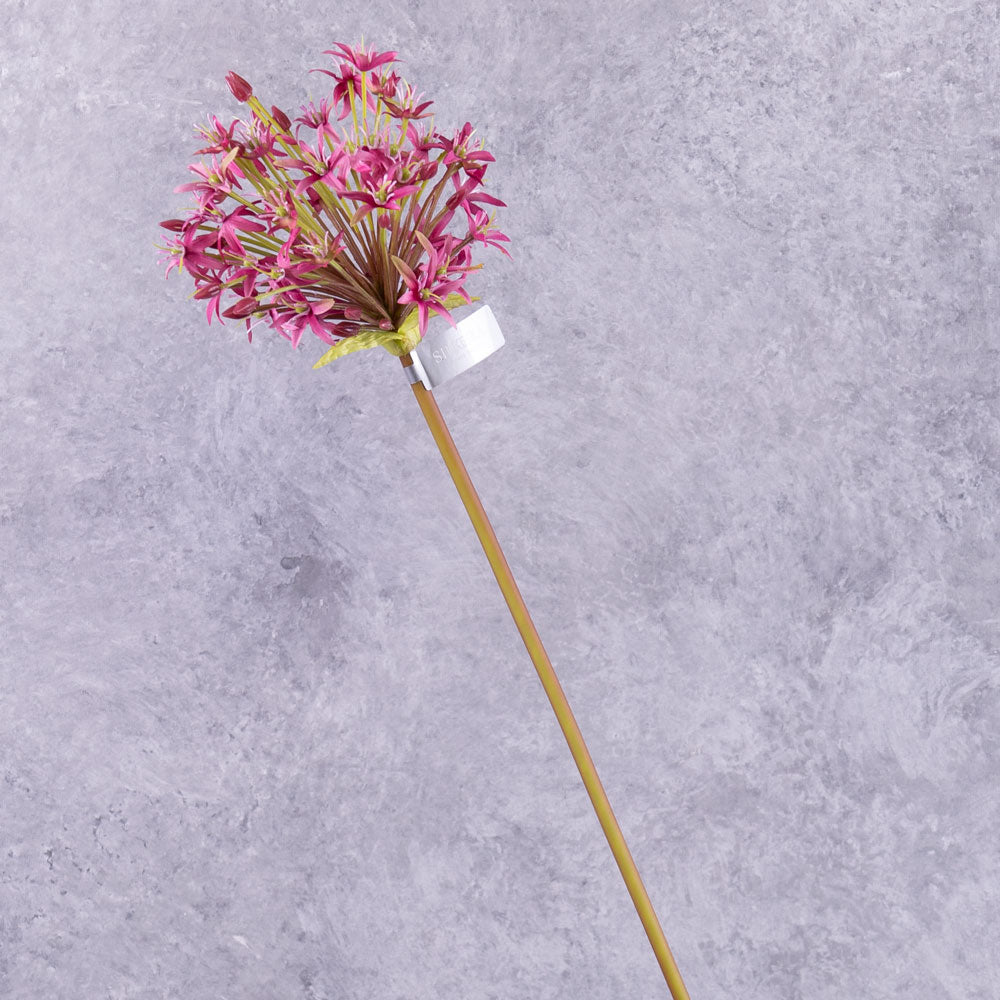 A single faux allium stem with a deep pink coloured flower plume