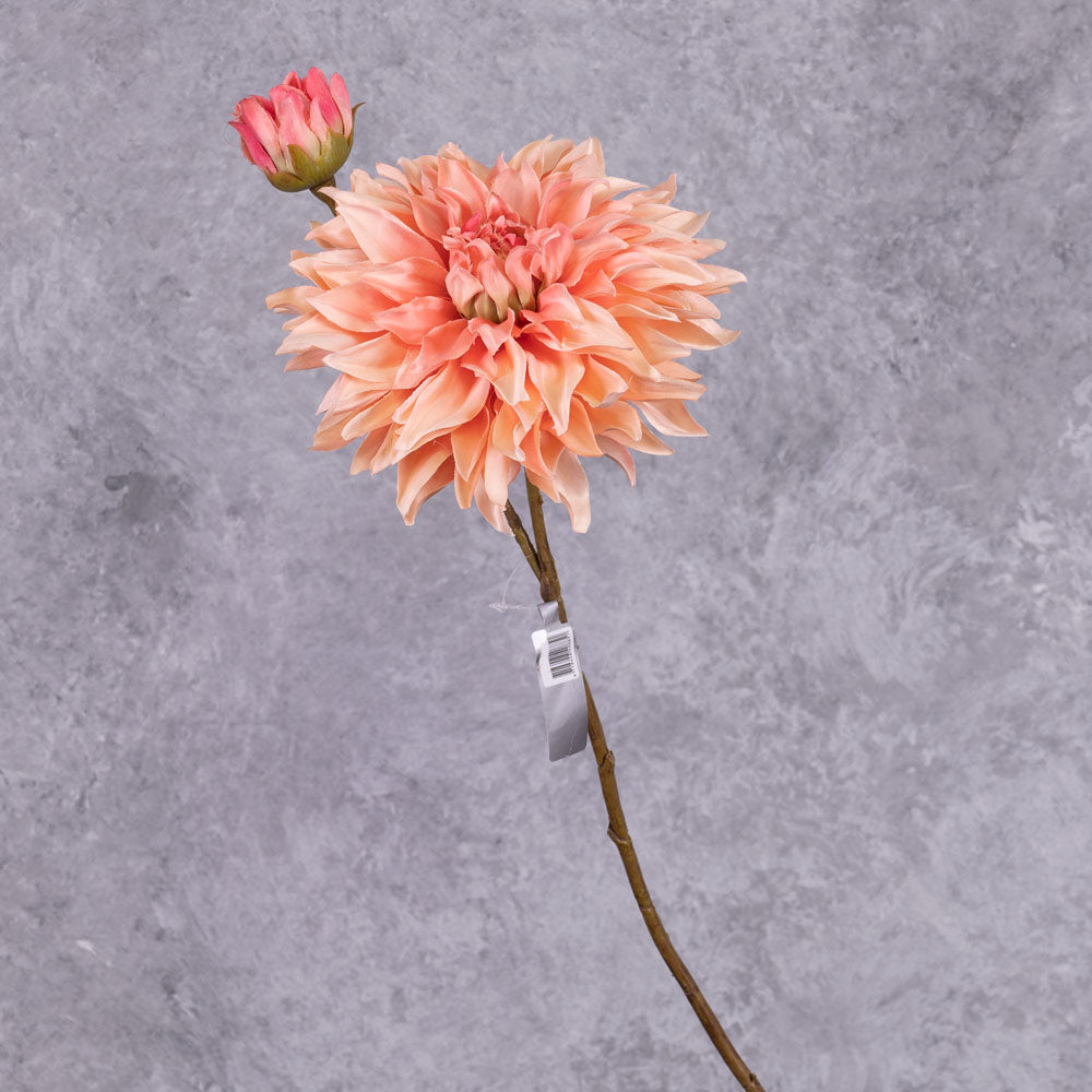 A single, faux dahlia spray, with a rich, salmon-coloured flower and emerging bud