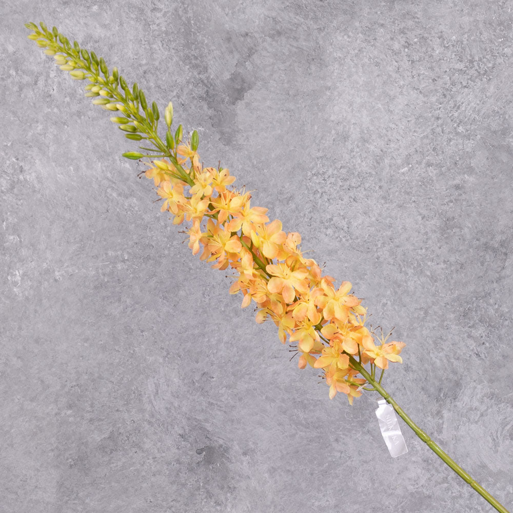 A faux peachy-yellow eremurus flower