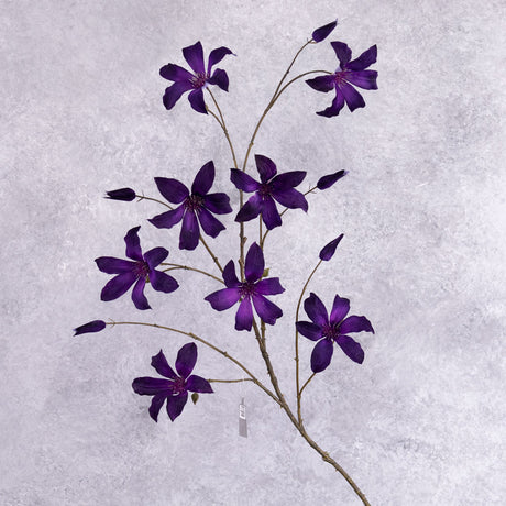 A faux clematis spray with deep purple flowers