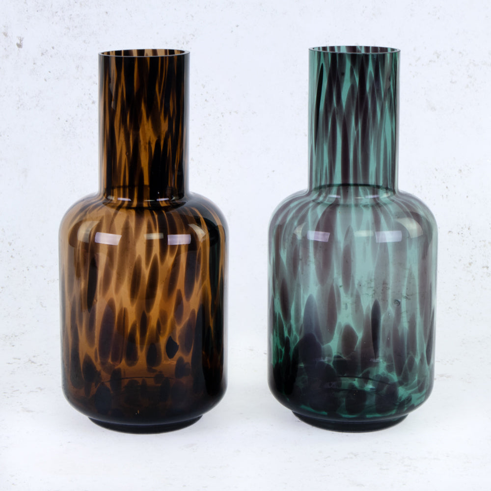 A pair of glass vases of the same style in a green and brown option