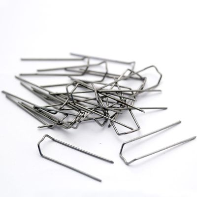 This image shows a group of mossing pins against a white background