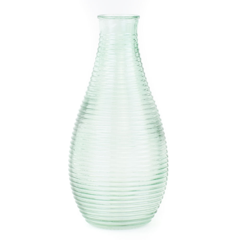 a glass vase, coloured translucent light green