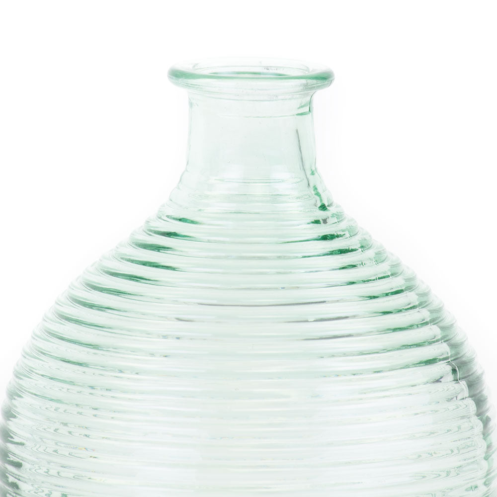 a glass vase, coloured translucent light green