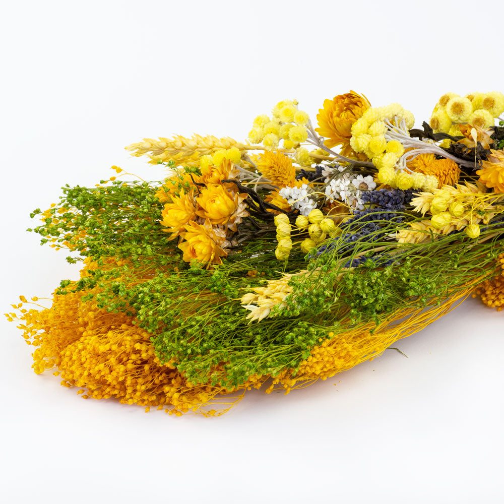 a bouquet made up with a selection of different flowers with a yellow theme