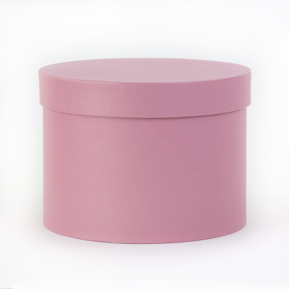 a baby pink coloured hat box