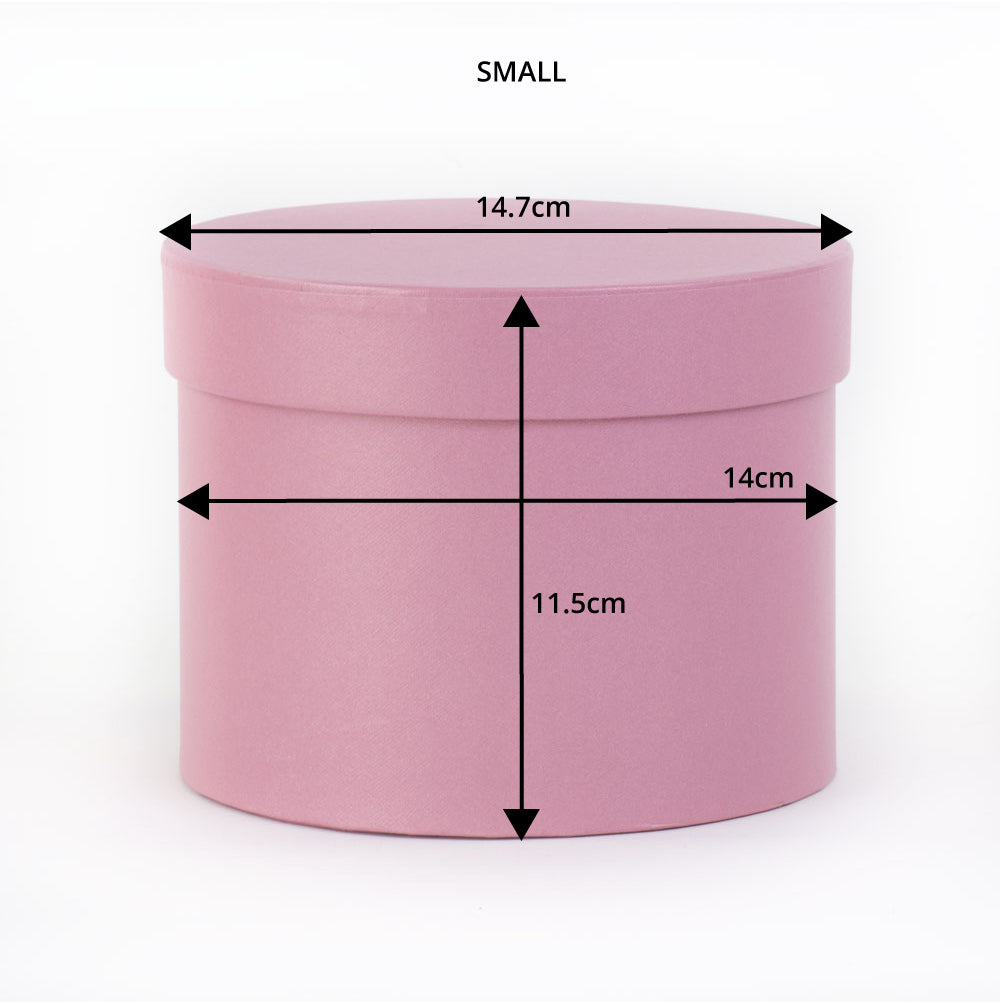 a baby pink hat box showing dimensions