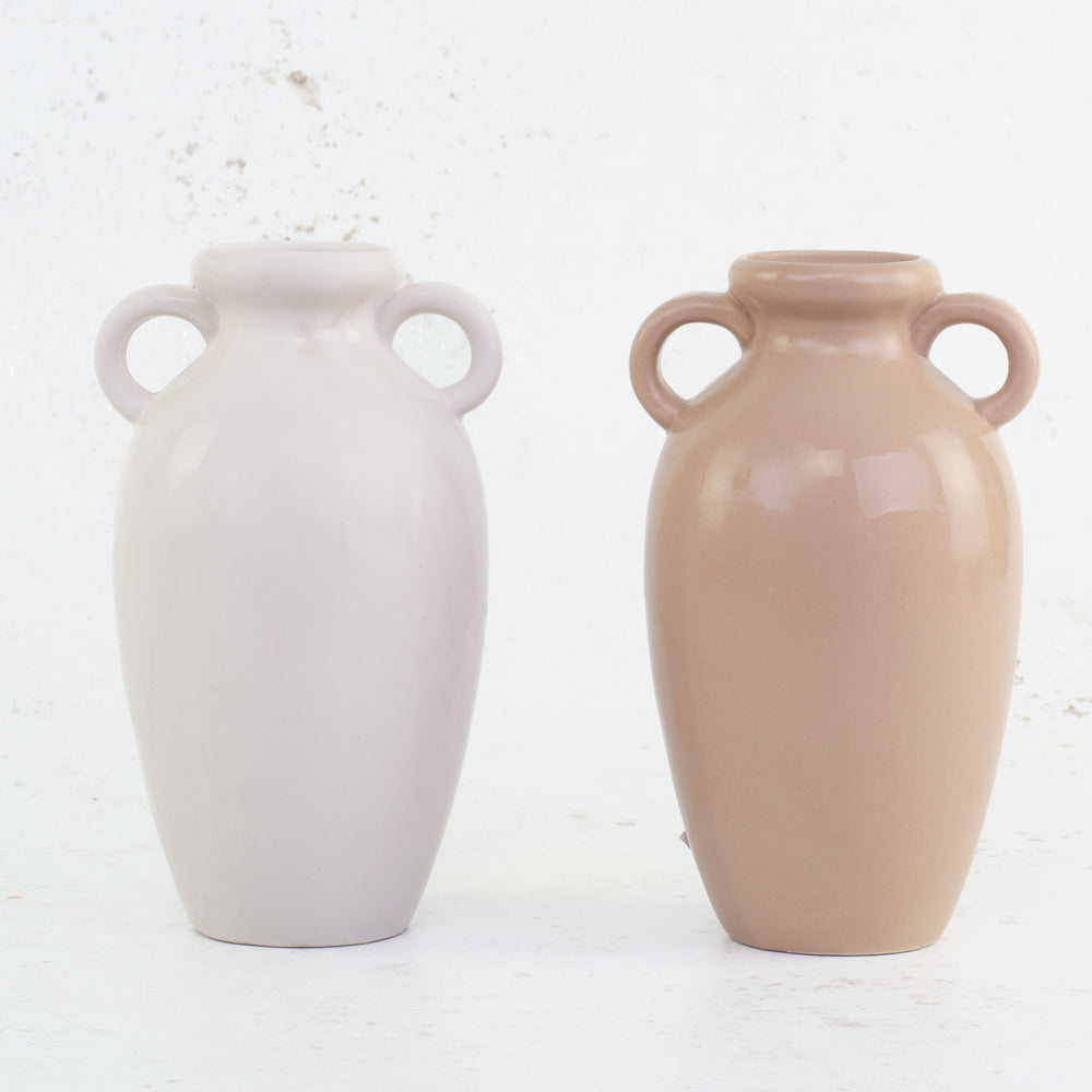 A pair of urn style vases in terracotta and white