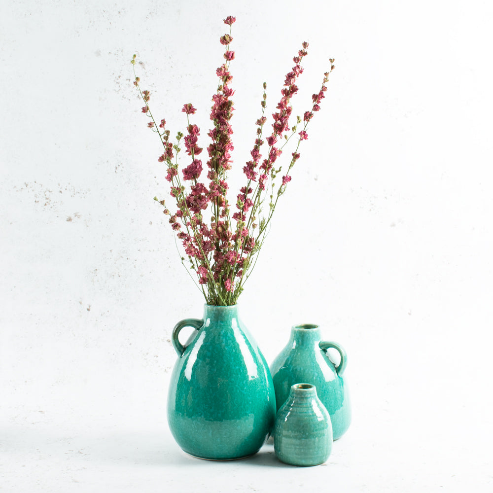 Mixed size turquoise bottle vases