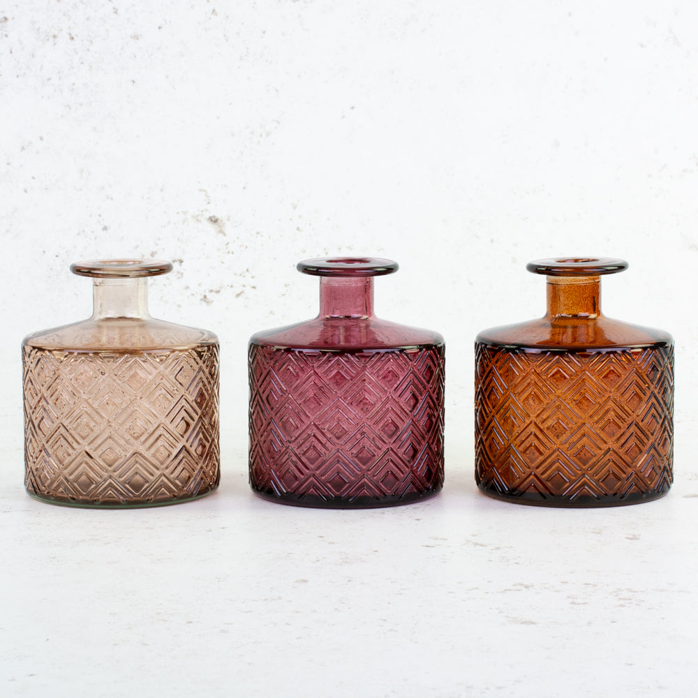 Trio of short bud vases in mixed colours